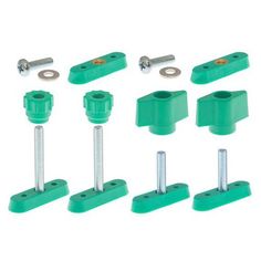 six green screws and two nuts on a white background, all in different positions