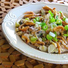 a white plate topped with meat and veggies