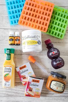 the ingredients needed to make an orange smoothie laid out on a white wooden surface