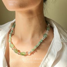 *Handcrafted: Each piece is meticulously handmade, ensuring a personal touch in every necklace. *Natural Stones: Utilizes genuine green agate stones, promising natural beauty and uniqueness. *Size: Features a 18-inch length with a 5cm extension chain for adjustable fitting. *Designer Piece: Exclusively designed by me, showcasing a blend of creativity and craftsmanship. | Key Highlights of the "Verdant Enchantment" Necklace | *Unique Craftsmanship: Every necklace is a testament to individual craftsmanship, with a dynamic spectrum of green from light to deep hues, reminiscent of nature's balance and serenity. *Material: Vibrant green agate beads paired with sparkling, transparent crystal beads, offering an elegant and refreshing look. *Versatility: Ideal for both daily wear and special occas Green Aventurine Beaded Necklace With Polished Beads, Green Aventurine Beaded Necklaces, Green Aventurine Round Beaded Necklaces, Green Aventurine Bead Necklace, Green Aventurine Round Beaded Necklace, Handmade Bohemian Green Emerald Necklace, Handmade Green Bohemian Emerald Necklace, Handmade Adjustable Green Emerald Necklace, Green Jade Beaded Necklaces