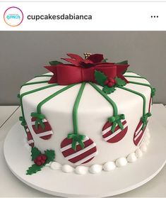 a white cake with red and green decorations