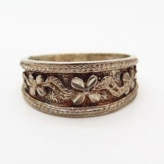 925 Sterling Silver Ornate Floral Design Ring Size 8 3/4Weight: 4.0gWELCOME TO PAWN SHOPWe are an actual pawn shop and have been in business for over 25 years.Since 1990, our establishment has been serving a variety of clients by providing them with short term cash solutions and options of liquidity regarding their treasured heirlooms.Acknowledging that today′s customers are very sophisticated and are looking for a variety of investments, our acquisitions are hand-picked for our special clientel Antique Silver Toe Ring, Vintage Jewelry With Decorative Round Band, Vintage Style Engraved Toe Ring, Vintage Engraved Toe Ring, Vintage Formal Toe Ring Jewelry, Silver Heirloom Wide Band Jewelry, Vintage Silver Flower Ring Stamped 925, Antique Silver Ornate Rings For Anniversary, Nickel-free Heirloom Rings For Anniversary