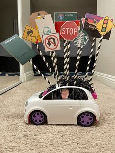 a white car with black and purple decorations in it