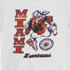 Vintage Ncaa Miami Hurricanes Mascot Logo Shirt, Miami Hurricanes Shirt, University Of Miami- Nba T-Shirt, Oversized Shirt, Graphic Tee Product Information Promise That You Will Get The Best Products We Have. With Variety Of T Shirts Styles, Sizes And Colors. Detail T-Shirt: 100% Premium Cotton Short Sleeve Unisex T-Shirt. Suitable For Ladies And Gentlemen. Natural And Organic Dyes Are Used And No Harmful Effects To Human Health. Fabric Weight: 5.0 Oz (Mid-Weight). Double-Stitched Seams At Shoul Nba T Shirts, University Shirt, Vintage Sportswear, Organic Dyes, Shirt Template, Ladies And Gentlemen, Mascot Logo, Logo Shirt, T Shirt Oversized