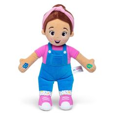 a stuffed doll with an apron and blue overalls