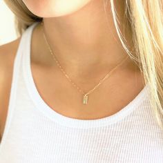 "Dainty Initial Charm Necklace . Dainty and meaningful, wear your favorite initials close to your heart. Choose 14kt gold filled or sterling silver options. These mini rectangle charms grace a drawn cable chain for a classic and minimal look. D E T A I L S -Rectangle Disc measures 10mm -Choose 14kt Gold-Filled or Sterling Silver - not plated. -A high quality drawn cable chain with a spring clasp. -Polished to a light satin finish. CUSTOM HAND STAMPING -Hand stamped with an initial or heart symbo Dainty Everyday Necklace With Rectangular Pendant, Delicate Rectangular Pendant Necklace For Everyday, Delicate Everyday Necklace With Rectangular Pendant, Minimalist Everyday Initial Necklace With Birthstone, Minimalist 14k Gold Filled Charm Necklace For Anniversary, 14k Gold Rectangular Pendant Jewelry For Everyday, Everyday 14k Gold Rectangular Pendant Jewelry, 14k Gold Rectangular Pendant For Everyday Wear, Dainty Everyday Initial Necklace With Birthstone