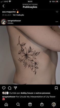 the back of a woman's stomach with flowers tattooed on her side and chest