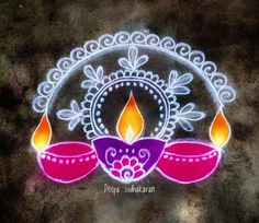 a colorful diya with two candles on it