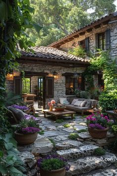 a stone patio with potted plants and flowers