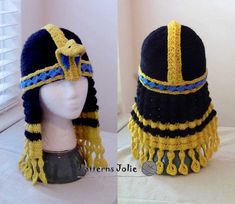 two wigs made to look like egyptian headdress, one in black and the other in yellow