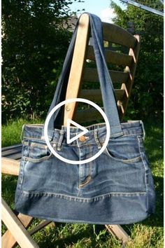 an old pair of jeans is being held up by a wooden chair with the bottom section removed