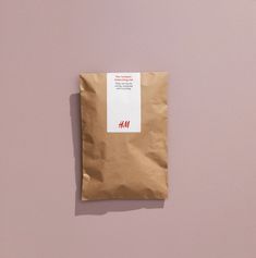 a brown paper bag with a red sticker on it