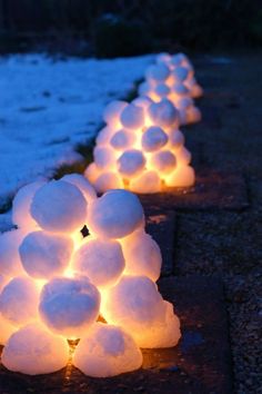 snowball lights are lined up along the sidewalk