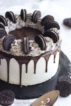 a cake with oreo cookies and cream frosting