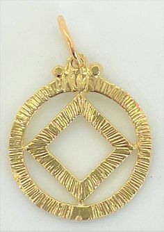 "Narcotics Anonymous NA Symbol in a textured Circle 11/16\" Wide by 7/8\" Tall with Loop & Jump-ring Weight: 1.3 grams - Style #44-9" 14k Gold Spiritual Round Pendant Jewelry, Spiritual 22k Gold Round Pendant Jewelry, Antique Gold Spiritual Round Pendant Necklace, 22k Gold Spiritual Round Pendant, Aa Symbol, Circle Chain, Narcotics Anonymous, Lake Elsinore, Twisted Wire