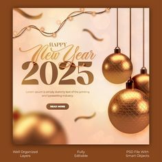 two golden christmas balls hanging from strings with happy new year message in the center and streamers