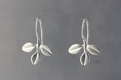 Silver Earrings - Adorable trefoil of leaves fixed on a simple hook wire. Perfect for everyday wear.<br><br>0.88l, 0.56w. Bright and oxidized silver feature sterling ear wires, gold features 18k plated nickel-free ear wires. Silver Earrings Aesthetic, Flower Wire, Simple Silver Earrings, Silversmithing Jewelry, Sliver Earrings, Silver Wire Earrings, Vintage Silver Earrings, Silver Jewellery Indian, Leaf Flower