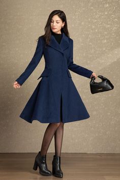 It is a princess coat in navy color. Navy has always been the most classic and mysterious color. Having a navy wool coat is essential for women. In the snowy winter, this long wool coat will make you look attractive to everyone.The  winter wool coat is a Unique design  and will let you shine wherever you go, perfect for every occasion.  ★★ FEATURES 50% wool blend, 50% fiber, nylon Polyester lining Two side pockets Invisible buckle wool coat Lapel collar wool coat Long sleeve wool coat Fit and flare wool coat Regular fit wool coat Mid calf wool coat Perfect for winter, autumn ★★ The model's height approx 170 cm (5′ 7″) with the 84 cm (33") bust, 66 cm (26") waist. She is wearing the wool coat in size XS (US2) ★★Bespoke Order Service Request other color Request the Length Request the sleeve A Line Coat, Womens Fall Coats, Navy Wool Coat, Winter Coat Women, Princess Coat, Wool Winter Coat, Long Wool Coat, Snowy Winter, Coat Winter