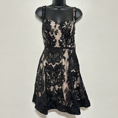 Size Large Bust 17" Pit To Pit Laid Flat Waist 14.5" Length 35" From Shoulder To Hem Retail For $78 The Lulus Love Eternal Black Sequin Embroidered Bustier Skater Dress Is Always The Hit Of The Party! Sheer Black Mesh Features An Elegant Embroidered Design With Matching Sequins, Over A Knit Lining As It Shapes Tank Straps And A Bustier Bodice With Padded Cups. Fitted Waist Above A Full Skater Skirt With Structured Hem For Added Flair. Hidden Back Zipper/Clasp. Beautiful Dress For Any Fancy Occas Black Dress With Corset Back, Black Mini Dress With Fitted Bodice For Prom, Black Corset Back Dress For Date Night, Black Dress With Corset Back For Date Night, Black Lined Dresses For Prom, Black Lined Dress For Prom, Lined Black Dress For Prom, Black Lined Lace Dress, Black Lace Dress With Corset Back