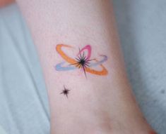 a small tattoo on the foot of a person