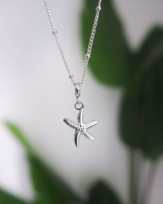 Our stunning Sea Star Silver Necklace effortlessly combines elegance with a touch of the ocean.🌟 The high quality silver stainless steel chain is adorned with a Sea Star pendant that brings a touch of coastal charm, making it a statement piece for any occasion. The Sea Star or Starfish is a symbol of resilience, regeneration, and the beauty of the ocean. With intricate detailing and a shiny silver hue, this pendant adds a touch of coastal charm to any outfit. Add this cute Sea Star Gold Necklac Star Silver, Star Necklace Silver, Coastal Charm, Seashell Necklace, Sea Star, Charm Making, Pendant Rings, A Sea, Shiny Silver