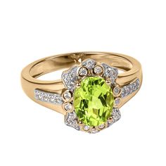 This stunning ring is meticulously crafted from sterling silver and finished with an opulent 18k two tone finish. At the heart lies a captivating oval Peridot, renowned for its vibrant green hue. This enchanting gemstone is beautifully complemented by shimmering white Diamondeau®, flawless simulated diamond. Each piece stands alone as a statement of beauty. An ideal gift for an August birthday. Luxury Oval Peridot Rings, Green Oval Rings With Halo Design, Oval Green Rings With Halo Design, Green Oval Diamond Ring With Center Stone, Green Cluster Ring With Gemstone Accents For Anniversary, Oval Rings With Diamond Accents For May Birthstone, Oval Green Birthstone Ring, Oval Green Birthstone Ring With Center Stone, Green Oval Birthstone Ring