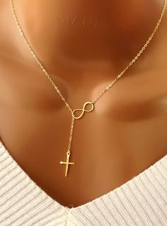 "Handmade with love! PERSONALIZED NECKLACE, CUSTOM JEWELRY, PERSONALIZED GIFTS. Infinity cross lariat necklace is gift ideas for her, bridesmaids, Christmas, baptism, mother, grandma, birthday, wedding.... MATERIALS: - Silver Plated chain and components. - Sterling silver Infinity size 8.3mm x 19.1mm. - Sterling silver Cross size 11.6mm x 20.6mm. - Model is wearing a 18\" inches necklace from end to end. - Gold Plated chain and components. - Gold Plated infinity. - Gold Plated cross. HOW TO ORDE Party Necklaces As Gifts, Gold Infinity Necklace For Birthday, Elegant Cross Lariat Necklace, Gold Cross Lariat Necklace As Gift, Elegant Cross Lariat Necklace For Gift, Elegant Cross Lariat Necklace Gift, Elegant Cross Lariat Necklace As A Gift, Mother's Day Gift Lariat Necklace With Adjustable Chain, Mother's Day Lariat Jewelry Gift