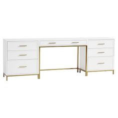 a white desk with gold legs and drawers