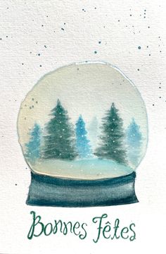 a snow globe with trees inside and the words bonnes fetes written below it