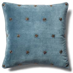 a blue pillow with gold stars on it