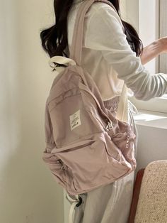 Editor's NoteLENEE.B's bags are good to match for everyday wear.- Feather-like lightness- Light nylon material used- Basic backpack shape- Big zipper pocket for extra storage- Side pocket is good for storing small belongings Measurements (in.)- Size: 12.60 in. * 14.17 in. * 3.94 in. Composition & Care- 100% Polyester- Wipe off moisture and stains with a wet cloth- Bright leather can get stained by denim or dark outfits- The seams generated during the product process and the shaking of fine seam lines are not defects.- Fabric products cannot be washed- Professional leather cleaning is needed- Due to the nature of the color coating, peeling of the color applied to the metal due to natural friction during use is a natural phenomenon.Designer- by LENEE.B Girly Backpacks, Cute Hand Bags, Fabric Products, Aesthetic Backpack, Simple Backpack, Dark Outfits, Back Bag, Cute Backpacks, Pink Backpack