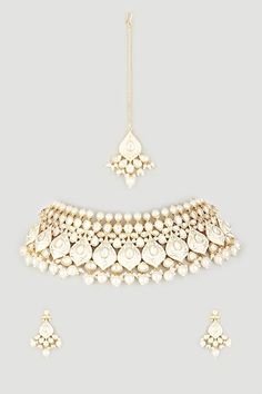 Gold toned choker necklace with white meena work, pearl drops and kundan embellishments. Comes with matching pair of earrings and a maangtikka. - Aza Fashions White Kundan Jewelry With Meenakari, White Meenakari Kundan Necklace For Ceremonial Occasions, Festive White Jewelry Sets With Mirror Work, Traditional White Jewelry With Mirror Work, White Temple Jewelry Bridal Necklace With Mirror Work, White Kundan Necklace With Gota Work For Receptions, White Kundan Necklace With Mirror Work For Reception, Ceremonial White Meenakari Jewelry Sets, White Meenakari Bollywood Choker