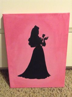 a pink box with a black silhouette of a woman holding a flower in her hand