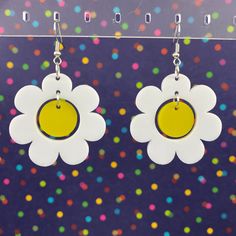 "Everything is coming up daisies! -Lightweight acrylic -Gold plated / stainless steel french hooks -Measurements: 1.6\" x 1.6\" Designed and handcrafted in Chattanooga, TN Actual colors may vary slightly due to differences in monitors and browsers. Contact us if you have any questions!" Handmade White Plastic Earrings, Trendy White Plastic Earrings, Trendy White Earrings, Retro White Flower Jewelry, Fun White Plastic Jewelry, Retro White Dangle Earrings, Summer White Nickel-free Flower Earrings, White Nickel-free Flower Earrings For Summer, White Plastic Summer Jewelry