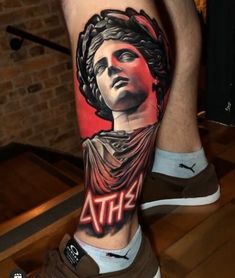 a man's leg with a tattoo on it that says, atheis