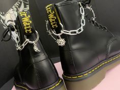 Welcome to this listing for our awesome stainless steel Sun & Moon boot chains! - Chunky stainless steel boot chains (Thick amazing quality!) - Sun & Moon charms - Stainless steel boot clip to hang off the back tag 2.5cm x 2.5 cm - Photographed on UK size 6 Dr Marten 1460 to give you and idea how they will look on your boots! - These can also be used as a cool bag/jeans chain or on other boots like Demonia or New rocks. - These come as a pair, one for each boot. These would make a fabulous gift for someone who loves their Dr Martens or a cheeky treat for yourself!   BOOT CHAINS COME IN AUTBOX ORGANZA GIFT BAG WE HAVE MATCHING NECKLACES AND BOOT CHARMS PLEASE SEE OUR OTHER LISTINGS. IF YOU HAVE ANY QUESTIONS POP ME A MESSAGE, IM ALWAYS HAPPY TO HELP. :) Platform Boots With Chains, Combat Boots With Chains, Doc Marten Charms, Platform Boots Chains, Doc Martens Boot Chains, Updated Closet, New Rocks, Steel Boots, Boot Charms