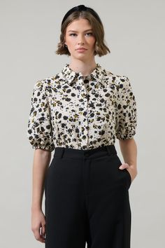 Add a nice touch to your wardrobe with the Jaleah Bubble Sleeve Button Up Blouse. Short bubble sleeves frame a collared neck with a button placket in the front. The fit maintains classic and fresh. Tuck in to high waisted pants for a classic look. - Bubble short sleeve- Button down - Classic fit- Cotton- Color: Ivory MultiSize + Fit - Model is 5'10" and wearing size XS- Measurements taken from size S - Chest: 19 3/4"- Length: 25" Fabric Self:100%cotton Style Number STT17426DR Bubble Sleeve, Button Up Blouse, Color Ivory, Cotton Style, Button Placket, High Waisted Pants, Classic Looks, Fitness Models, Button Up