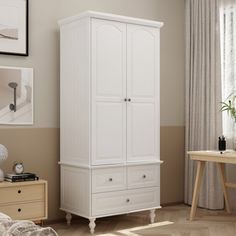 a white armoire with drawers in a room