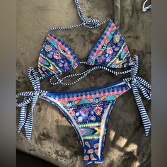 Shein Floral Boho Bikinki The Colors Are So Bold And Bright I Just Love Them. It Is Super Cute And Very Cheeky. Blue, Pink, Yellow, Teal, Purple And White. Never Worn But No Tags. Size M For Both Top And Bottom Blue Printed Swimwear For Beach, Blue Printed Swimwear For The Beach, Blue Printed Swimwear For Vacation, Printed Blue Swimwear For Vacation, Blue Printed Halter Neck Swimwear, Beachy Blue Printed Swimwear, Blue Printed Swimwear For Beach Party, Blue Bohemian Swimwear For Pool, Bohemian Blue Swimwear For Pool