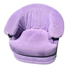 a large purple chair sitting on top of a white floor