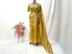 Tissue saree with embroidered blouse for women. * Plus size available. * Size: This is custom made outfit as per your size. Post your order we will send you a measurements reference sheet using which you can provide details required to make your outfit with best fit. * Fabric and work: Saree - Tissue fabric. Blouse - Embroidered georgette. * Delivery time: This saree blouse set will take 2-3 weeks to produce after we have received your sizing details. Don't worry it can be made sooner too, just Yellow Tissue Silk Blouse Piece For Party, Yellow Tissue Silk Party Blouse Piece, Yellow Tissue Silk Blouse For Festive Occasions, Yellow Tissue Silk Pre-draped Saree For Festive Occasions, Tissue Saree Blouse, Yellow Tissue Saree, Tissue Fabric, Blouse Indian, Tissue Saree