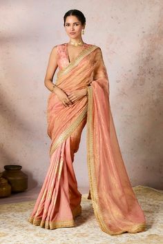 Peach half and half crushed and foil print saree embellished with jhalar and kinari embroidered border. Comes with an unstitched piece. - Aza Fashions Luxury Peach Saree With Pallu, Luxury Peach Saree For Reception, Luxury Designer Peach Pre-draped Saree, Luxury Peach Chanderi Saree, Luxury Peach Georgette Saree, Luxury Peach Saree Dress, Luxury Peach Pre-draped Saree For Women, Luxury Fitted Peach Saree, Luxury Semi-stitched Bohemian Saree