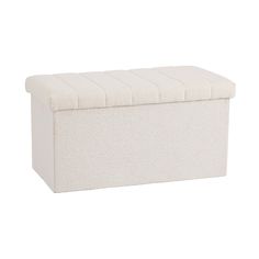 an upholstered white storage box on a white background