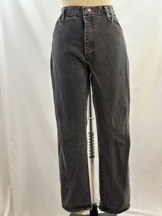 These 80s Rustler jeans will be a closet staple. High waisted, they are a faded black, have a straight leg with a mom fit. Perfect for a fitted turtleneck or a tucked in sweater. -Vintage 90s -Faded black, high waisted -Machine wash recommended  Measurements: *Waist 16 1/2  inches *Hips 20 inches *Inseam 29 inches *Length 39 inches *This item is pre-loved and there may be minor flaws to the garment. Not to worry if there is anything major we will let you know. *worn in look, distressing on zippe Rustler Jeans, Faded Black Jeans, Jean Vintage, Jeans High Waisted, Fitted Turtleneck, Jeans Mom, Womens Jeans, Historical Clothing, High Waisted Denim