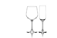 two wine glasses sitting next to each other