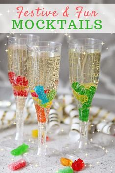 two champagne flutes with gummy bears in them and the words festive & fun cocktails