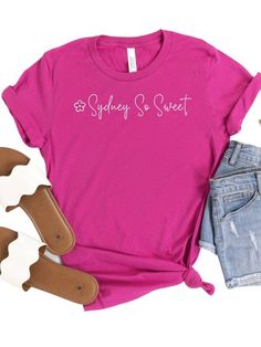 Look your sweetest in the official Sydney So Sweet tee! Made of a blissfully soft cotton blend, this high-quality short sleeve shirt comes in six delicious colors and seven sizes, so you're sure to find your perfect fit. Plus, show off your love of this sweet company! INCLUDES: T-Shirt UNISEX SIZES: XS, S, M, L, XL, XXL, XXXL FIT: This item is true to size. FABRIC & CARE: Machine Washable 100% combed and ring spun cotton (fiber content may vary for different colors) Bella + Canvas Brand This cla Sweet Summer T-shirt With Crew Neck, Sweet Short Sleeve Cotton T-shirt, Sweet Style Short Sleeve Cotton T-shirt, Sweet Cotton T-shirt With Short Sleeves, Cute Soft-washed Pink T-shirt, Sweet Summer T-shirt With Letter Print, Summer Sweet T-shirt With Letter Print, Sweet Tee, Columbia Blue