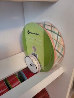 there is a spool of ribbon on the shelf