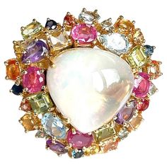 Bochic "Orient” Opal & Multi Gem Cluster Ring Set In 18K Gold & Silver White Opal - 12 Carats Cluster Multi Color Fancy Sapphires from Sri Lanka Sapphire colors : Pink, Yellow, Green, Light Blue, Orange, Lilac Ruby, Amethyst, Blue Topaz 9 Carats This Ring is from the "Orient" traveling collection are the epitome of elegance and versatility. It offers a perfect blend of day to night and swimwear to evening wear, allowing you to effortlessly transition between different occasions and outfits. Wear Multi Gem Ring, Gem Cluster, Vintage Cluster Ring, Pearl Cocktail Ring, Cluster Ring Set, Fancy Sapphire, Bangles Jewelry Designs, Blue Topaz Stone, Sapphire Color