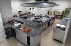 an industrial kitchen with stainless steel appliances and counter tops